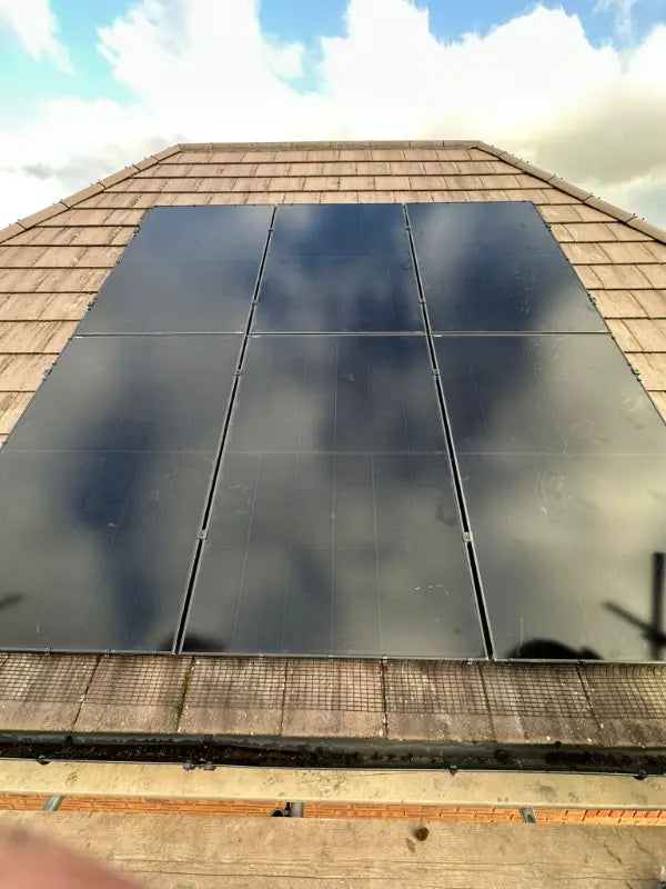 All-black solar panels on a tiled roof