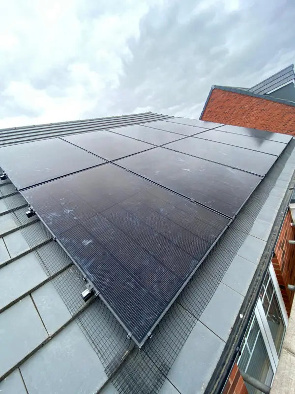 Close-up of black panels on a slate roof