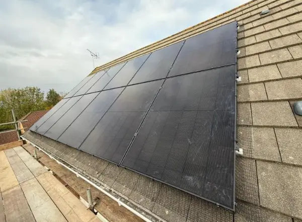 Panels on a slate roof, seen from the scaffold