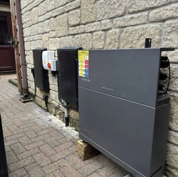 EcoFlow PowerOcean inverter and battery on a stone wall