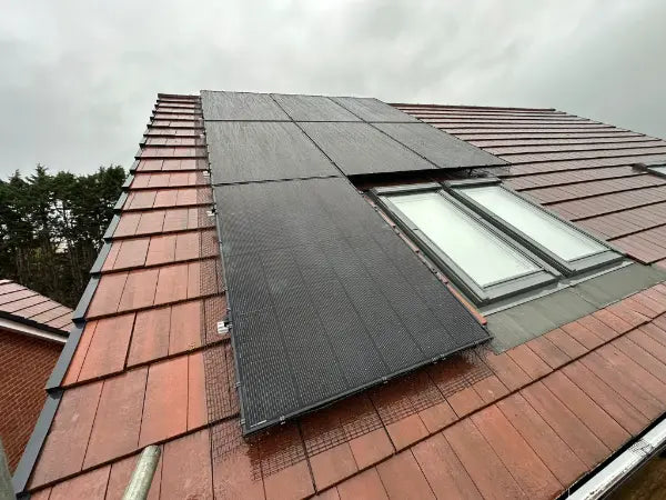 Panels fitted around two roof windows