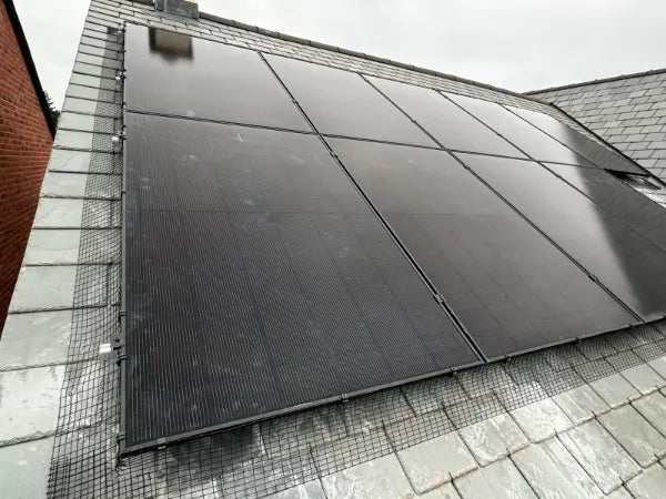 Black panels on a slate roof