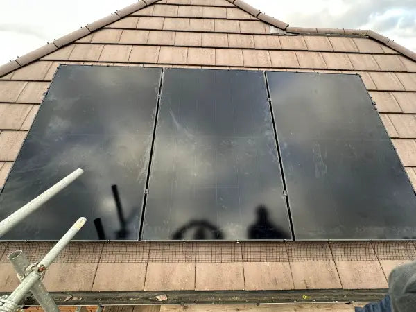 Three panels on a small tiled roof