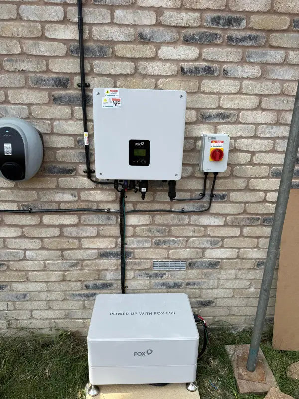 Fox ESS inverter beside an electric car charger