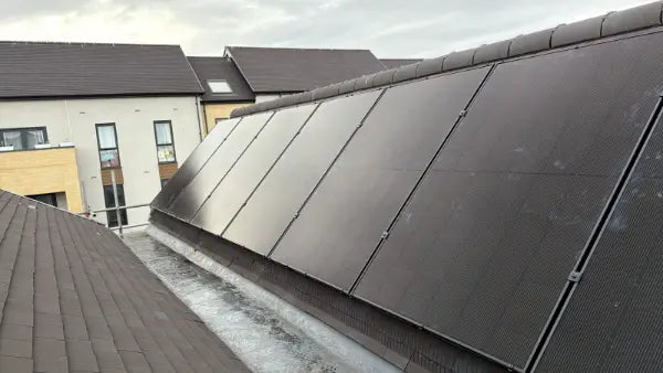 A long row of panels on a slate roof